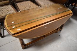 A modern oak drop leaf coffee table, width approx. 112cm
