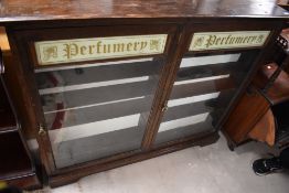 A late Victorian Perfumery shop display cabinet, of slim form, dimensions approx. W126 H106 D18cm