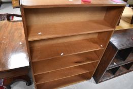 A vintage teak bookshelf, dimensions approx. H127 W94 D25cm