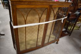 An early 20th Century china cabinet on ball and claw feet, dimensions approx. W119 H121 D31cm
