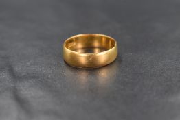 A 22ct gold wedding band of plain form, size K & 3g