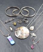 A small selection of silver and white metal jewellery stamped 925 including bangle, rings,