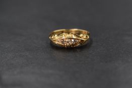 An 18ct gold diamond set five stone ring, the five graduated old cut diamonds, in a channel style