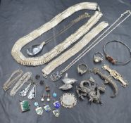 An assortment of silver and white metal jewellery, including a wire filigree necklace and
