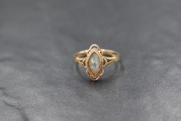 A presumed 9ct gold opal doublet set ring, the marquise opal doublet in a bezel setting within a