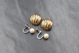 A pair of 9ct gold clip earrings of moulded form and a pair of 9ct white gold screw back cultured