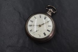A William IV silver key wound open face pocket watch, the white dial having Roman numerals, in an