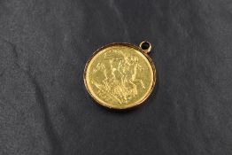An 1887 Victorian double sovereign in a removable yellow metal mount, coin approx 15.7g & mount 3.