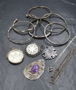 A small selection of white metal and silver jewellery including pendants and bangles