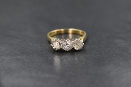 An 18ct gold diamond trilogy ring having three brilliant cut diamonds, total approx 1.5ct in a