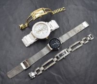 Four ladies fashion quartz wrist watches including Skagen, Fossil, Swarovski and Guess, non