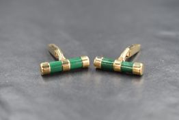 A pair of 9ct gold malachite set cufflinks, the cylindrical malachite having gold covered ends