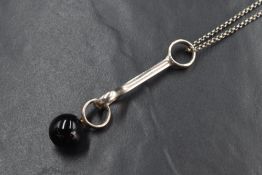 A Georg Jensen silver and onyx sphere pendant and chain by Regitze Overgaard, having an onyx