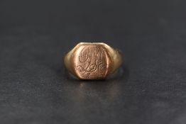 A gent's yellow metal signet ring of plain form bearing a monogram, marks worn, possibly 9ct rose