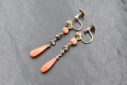 A pair of 9ct gold screw back earrings of naturalistic form having coral and old cut diamond drops