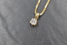 An 18ct gold diamond solitaire pendant, approx 0.75ct in a four claw set mount on an 18ct gold wheat