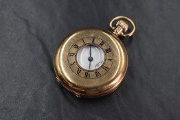 A 9ct gold top wound half hunter pocket watch having Arabic numeral dial with subsidiary seconds