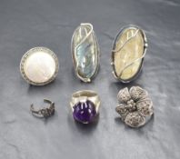 A group of six silver and white metal rings, comprising two artisan labradorite and rutile quartz