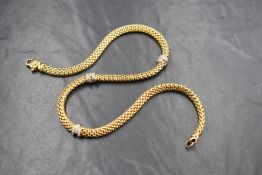 An 18ct gold diamond set Fope Gioielli necklace, the woven gold chain having three diamond set white