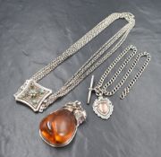 Three pieces of silver jewellery including a watch chain with shield medallion and T bar,