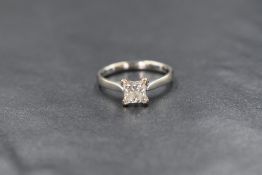 An 18ct white gold diamond set solitaire ring, the princess cut diamond measuring approximately 1.