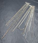 An assortment of fourteen silver chains, including rope link, snake link, belcher link and box link,