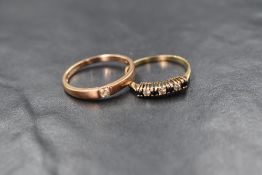 A 9ct rose gold diamond set band, the single round brilliant cut diamond in a pressure setting,