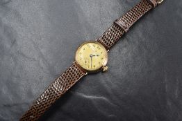 A 9ct gold Omega wristwatch, the gold tone dial having Arabic numerals with a subsidiary dial at