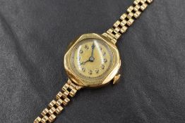 A ladies vintage 18ct & 9ct gold wrist watch having an Arabic numeral dial to gold and silver