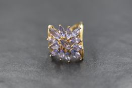 A 9ct gold pale blue open flower cluster ring by QVC, the marquise cut stones possibly tanzanite,