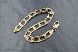 A 9ct gold diamond set curb link bracelet, four of the wide curb links set with diamond chips to the
