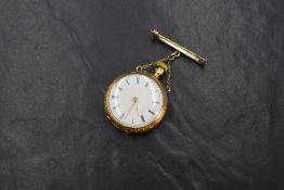 A continental 14ct gold top wound open face pocket watch, the white dial having Roman numerals