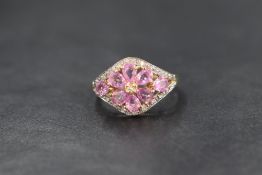 A 9ct gold pink sapphire cluster ring by QVC, having a central daisy cluster within a border