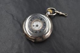 A Continental silver top wound half hunter pocket watch having Roman numeral dial with subsidiary