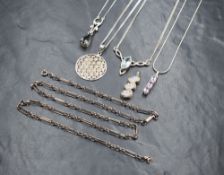 A selection of silver pendants including moonstone, amethyst and aqua marine style, and a silver