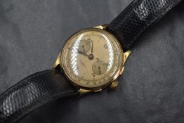 An 18ct gold cased chronograph wristwatch, the gold tone dial having Arabic numerals and two