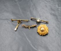 A yellow metal mourning brooch, of circular form having decorative scroll and bead work with a