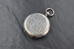 A white metal key wound Hunter pocket watch, presumed silver, having Roman numeral dial with gold