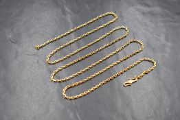 A high carat gold rectangular belcher link chain, having a 'S' hook clasp, tests as high carat gold,