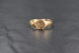 A 9ct gold signet ring, the rounded panel having 'CD' monogram and scroll engraving, marked 375,