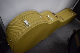 A jumbo guitar sized yellow tweed Thomann hard case