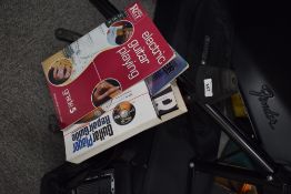 A small selection of guitar books and guitar stand