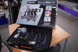 A Shure drum mic kit (DMK57-52) comprising 3 x Sm57s, 1 Beta 52, and three A56D drum mic clamps
