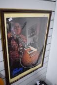 A framed advertising poster for Gibson guitars, approx. 74 x 54cm