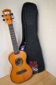 A modern LAG Ukulele, Concert model U77C, serial number 1106YY00438, sold with padded branded case