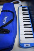 A modern Stagg Melodica in carry case