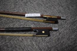 Two traditional bows, one having moulded celluloid name, Glasser