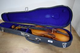 A vintage violin, having two piece 13inch back (3/4) labelled interior Suzuki 1972, sold with fitted