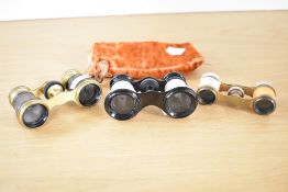 A quantity of early 20th century opera glasses, to include a mother of pearl example, a French