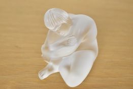 A 20th-century French Lalique crystal nude figure titled 'Nu Sage', depicting a serene seated male